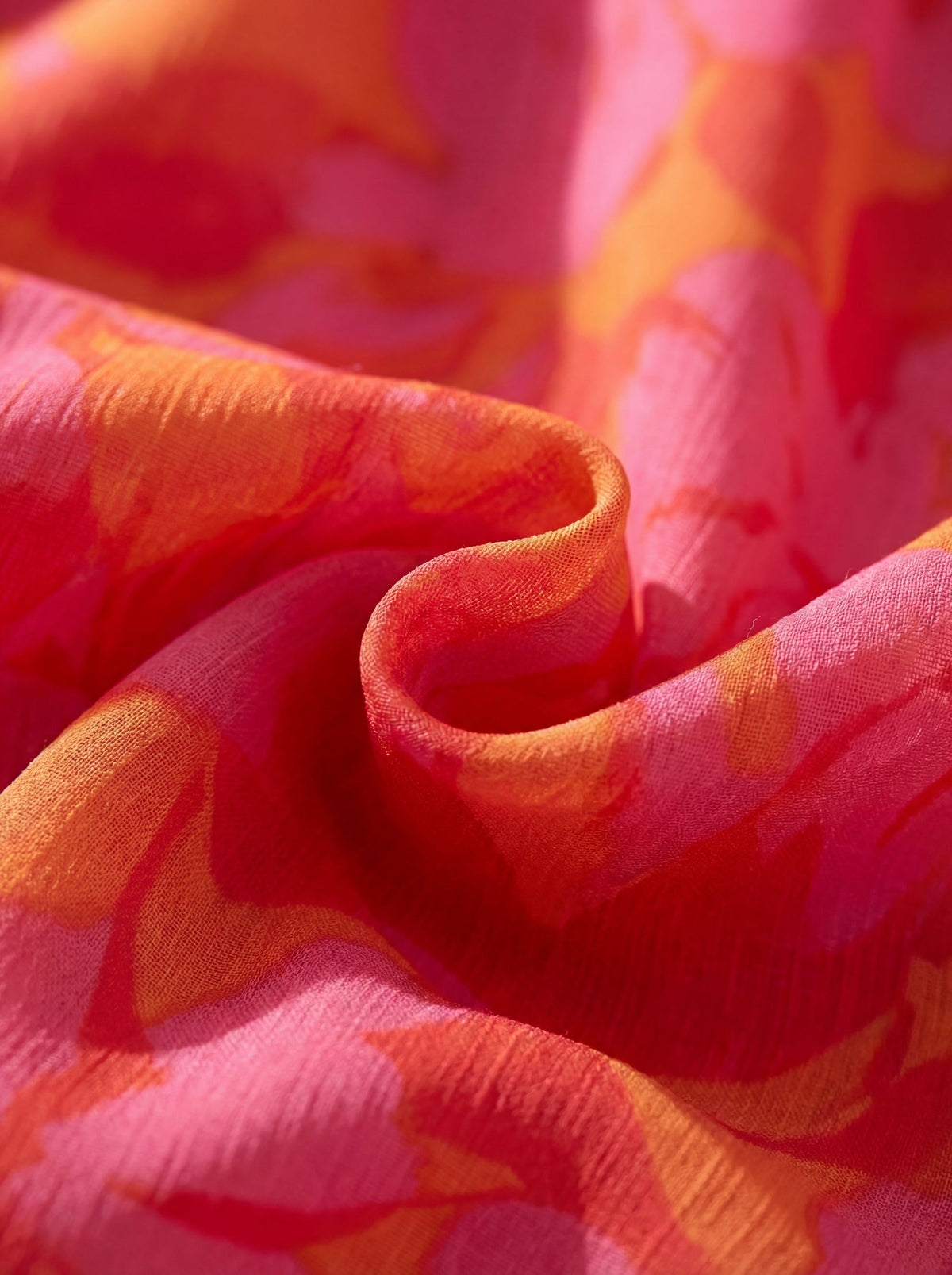 Ilenia vestido fluido rosa y naranja detalle del tejido